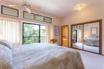 The master bedroom features a king bed and small, private lanai